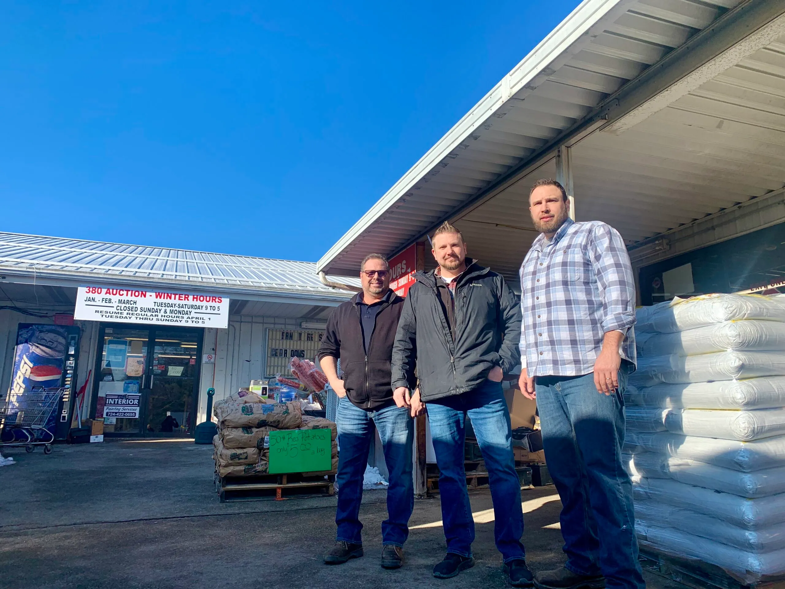 (Left to Right) Dave Beacom, Jim III Beacom, and Matt Beacom stand outside of 380 Market Discount Warehouse where they have worked amoung close family for years. (Shannon M. Venditti).jpeg